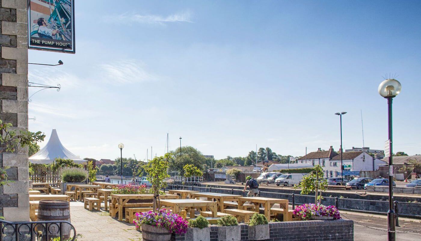 The Pump House gastropub with spacious garden and people enjoying drinks near Bristol docks