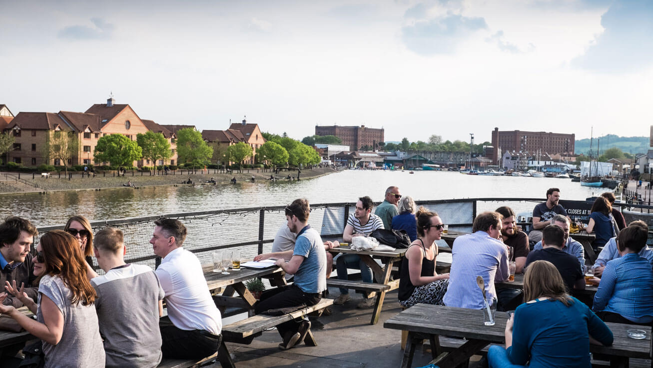 The Grain Barge pub boat with top deck open for alfresco dining and stunning harbour views