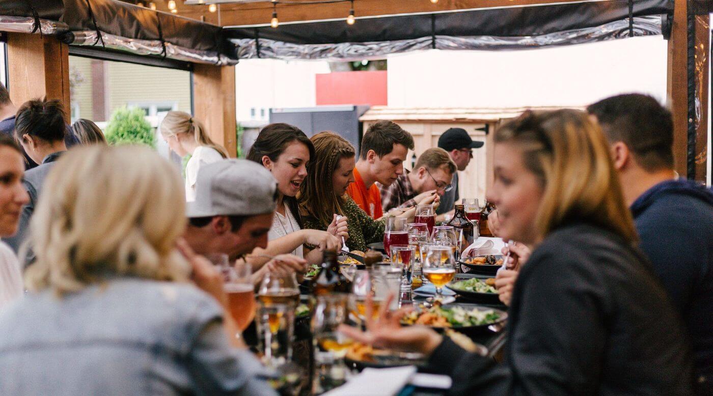 The Full Moon's lively beer garden with people socialising