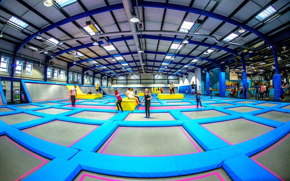 Excited children bouncing on trampolines at AirHop Bristol, a popular indoor trampoline park